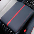 Armrest cover with red stitching