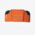 Orange glasses case resting on center console
