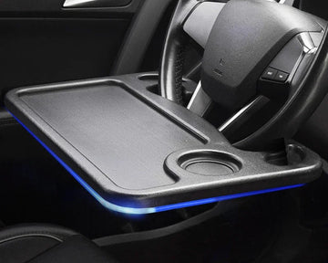 Steering wheel desk with built-in cup holder for easy organization and convenience during travel