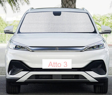 Silver BYD Atto 3 with black front windshield sunshade